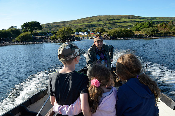 Going to mass on Church Island - a 6th century monastic site in the middle of Lough Currane